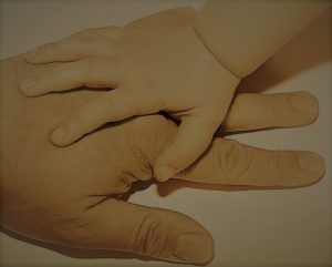 hands of parent and child